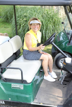 Golf volunteer in cart